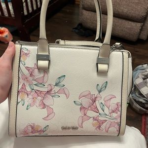 Mint condition Calvin Klein purse. Used once and never touched again.